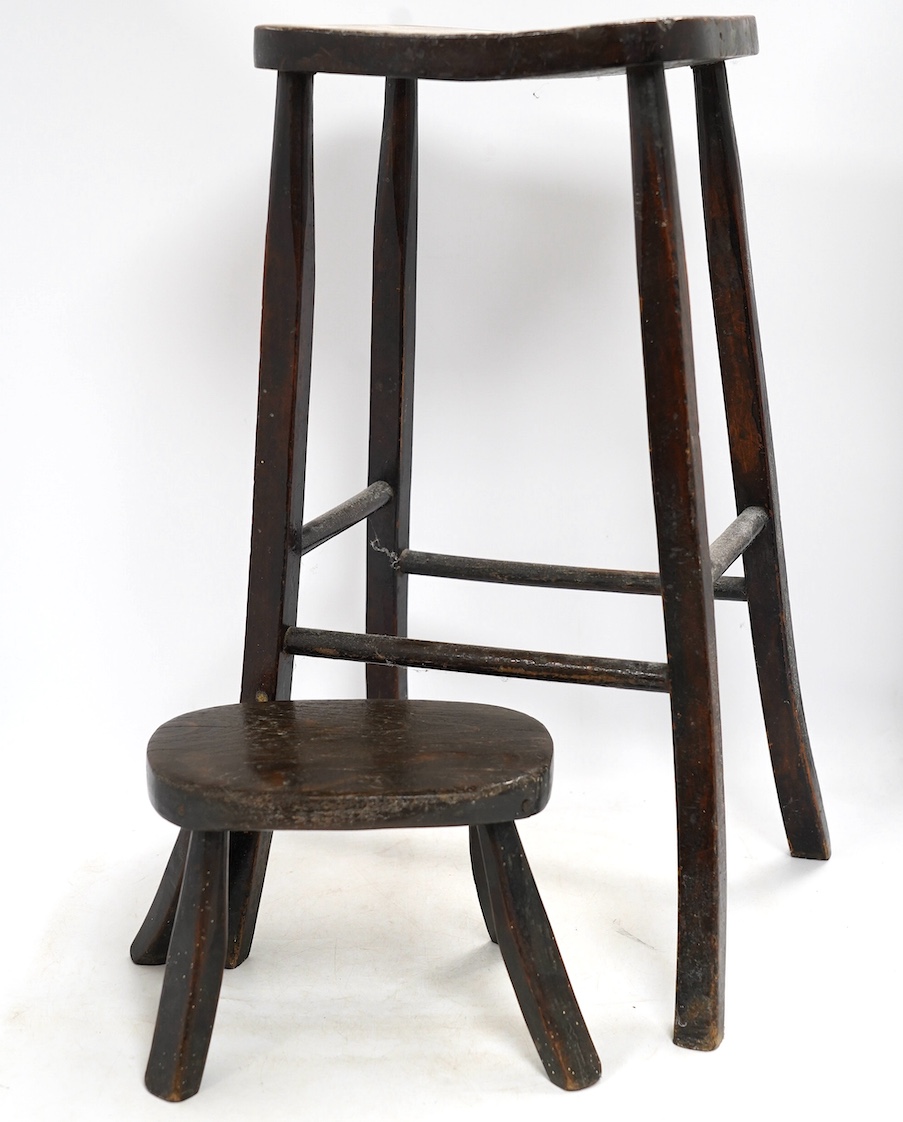 A Victorian elm and beech stool, 54cm high, together with a smaller child's stool. Condition - fair